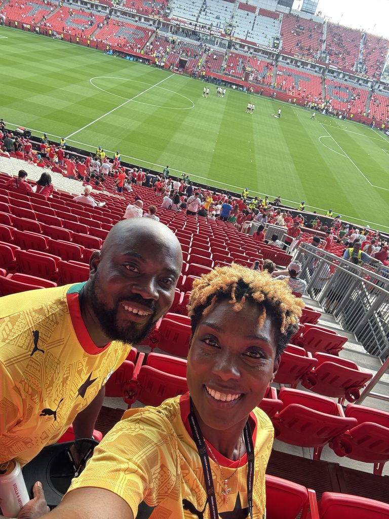 Sally-Ann and Nathan in the stands at a FIFA World Cup Soccer Game
